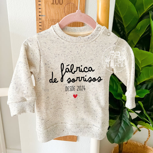Sweatshirt bebé menino “Fábrica de sorrisos desde…”